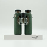 SWAROVSKI green cl pocket binoculars with white background on a stand.