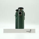 SWAROVSKI green cl pocket binoculars with white background on a stand.
