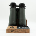Pre-owned Vortex Kaibab HD 18x56 binoculars, objective side, three-quarter view on Vortex retail block - The Lookout, Prescott AZ