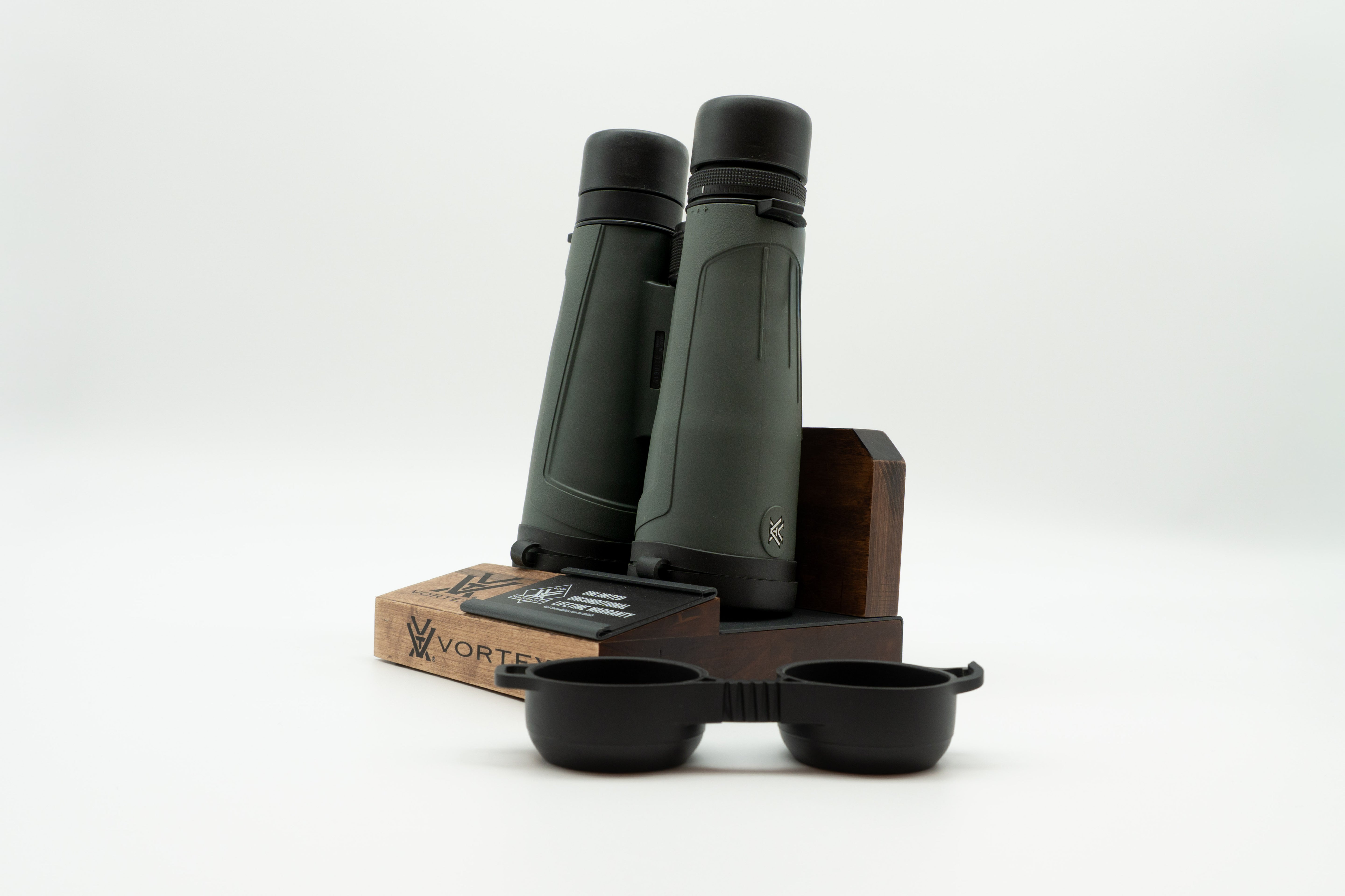 Pre-owned Vortex Kaibab HD 18x56 binoculars, objective side, three-quarter view on Vortex retail block - The Lookout, Prescott AZ