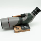 Pre-owned VORTEX Razor HD 20–60x85 Angled Spotting Scope, objective side, three-quarter view on Vortex retail block - The Lookout, Prescott AZ