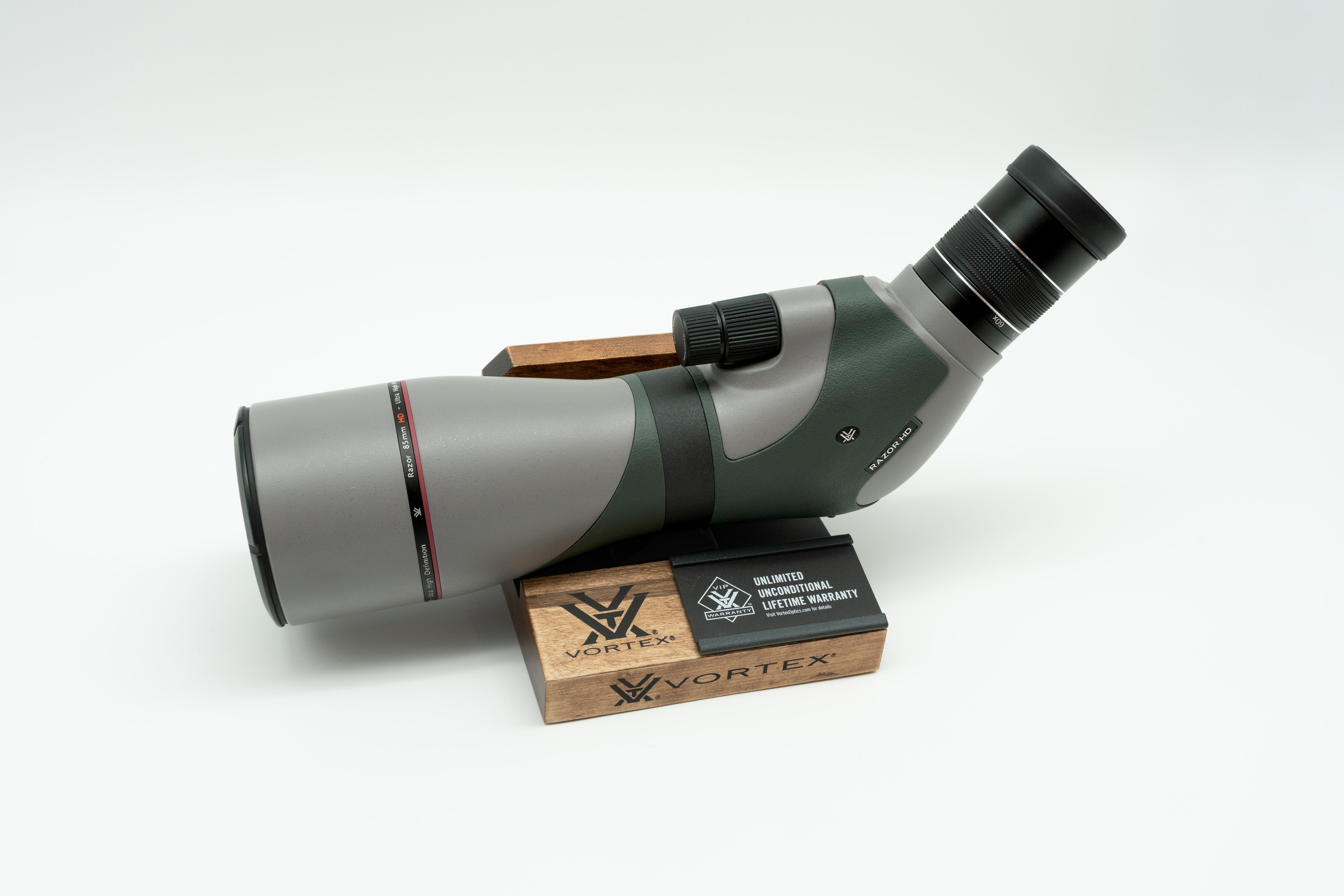 Pre-owned VORTEX Razor HD 20–60x85 Angled Spotting Scope, objective side, three-quarter view on Vortex retail block - The Lookout, Prescott AZ