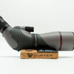 Pre-owned VORTEX Razor HD 20–60x85 Angled Spotting Scope, objective side, three-quarter view on Vortex retail block - The Lookout, Prescott AZ