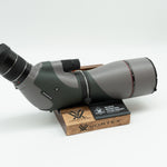 Pre-owned VORTEX Razor HD 20–60x85 Angled Spotting Scope, objective side, three-quarter view on Vortex retail block - The Lookout, Prescott AZ